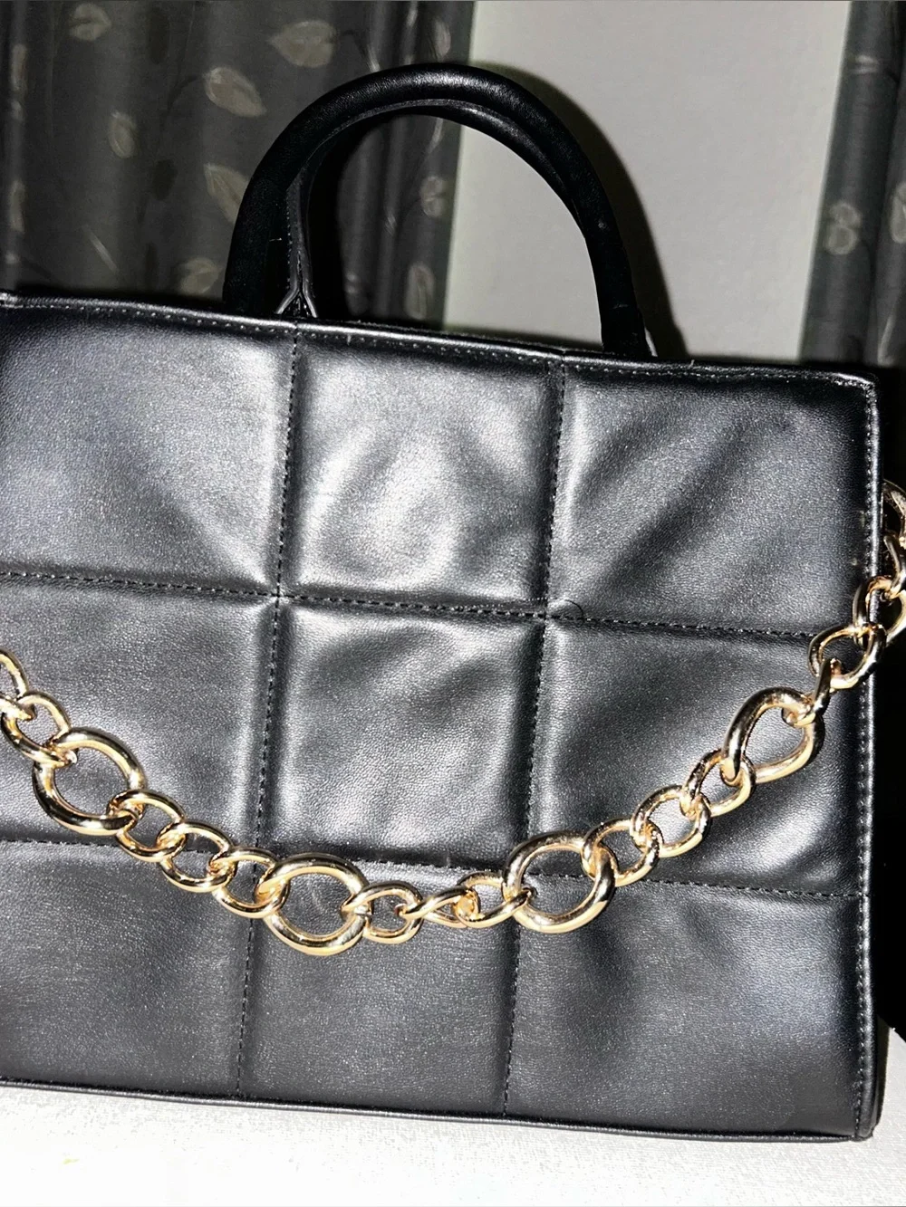 Black Quilted Top-Handle Tote with Gold Chain Accent